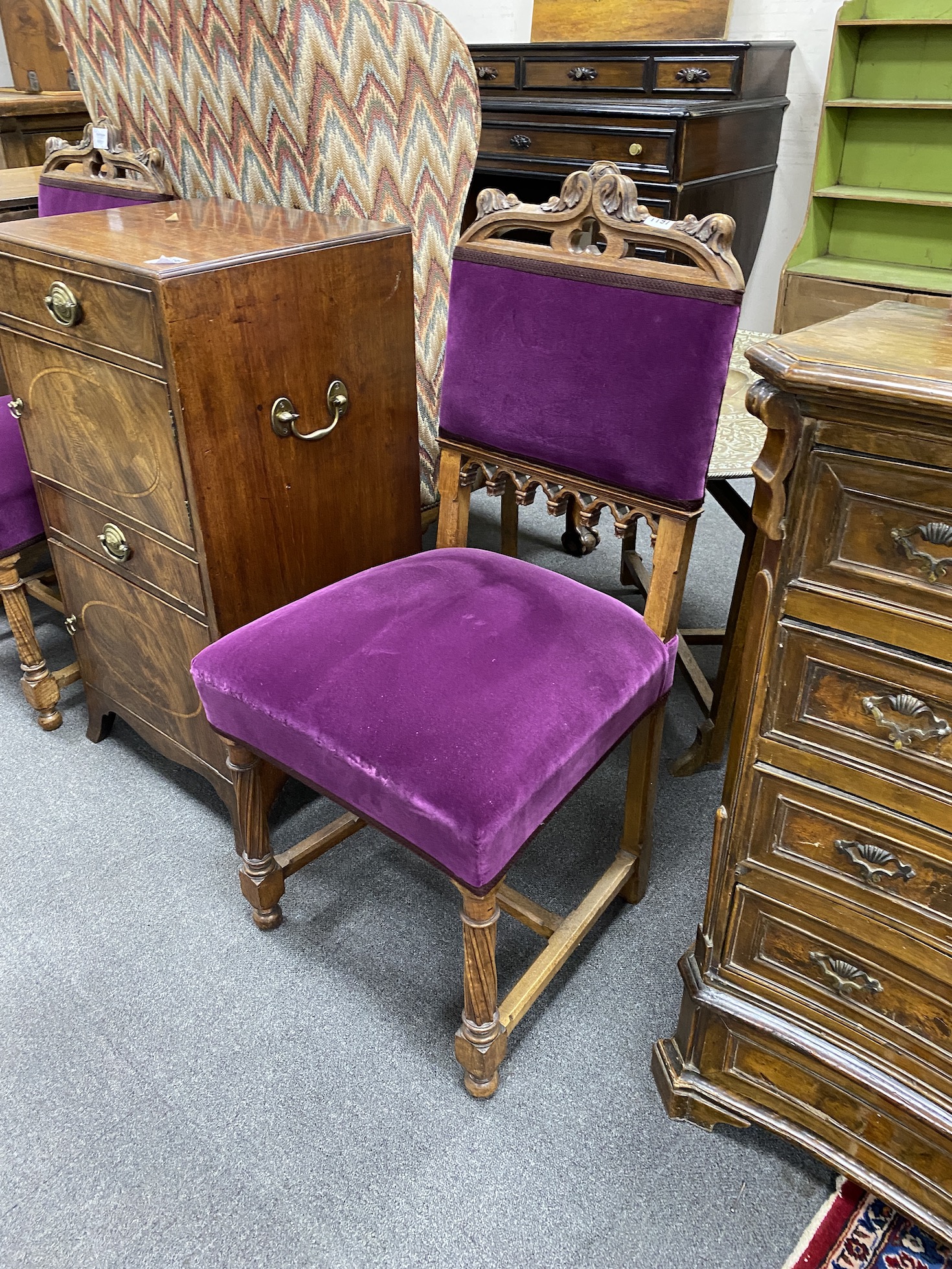 A pair of Victorian oak Gothic revival dining chairs, width 46cm, height 97cm